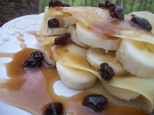 rum raisin sauce over crepes